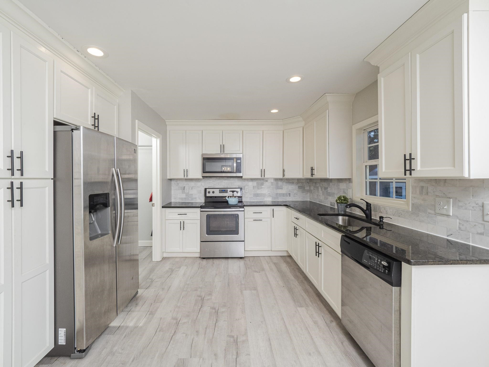 1440 Sedwick Road Durham, NC 27713 - Photo 5 of 23 Granite Counters & Tile Backsplash