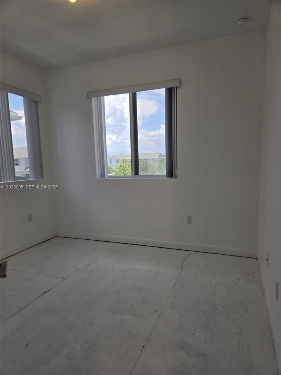 862 Southeast 17 Street, Unit 862 Homestead, FL 33034 - Photo 10 of 39 an empty room with a window