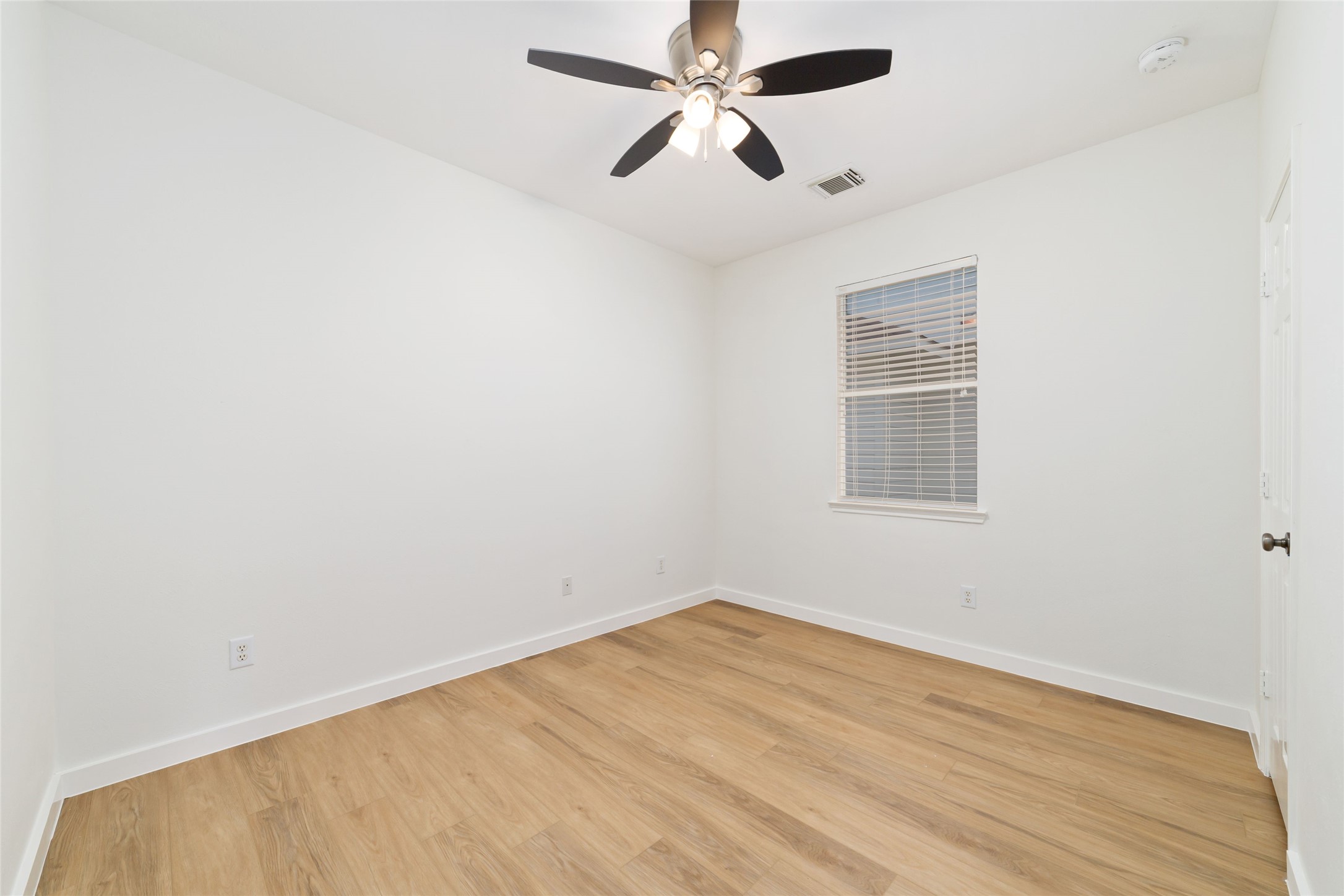20215 Enchanted Rose Cypress, TX 77433 - Photo 15 of 24 an empty room with a window and ceiling fan