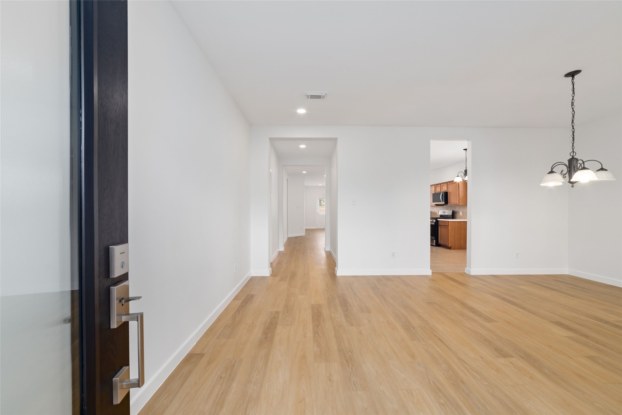 20215 Enchanted Rose Cypress, TX 77433 - Photo 3 of 24 a view of a room with wooden floor