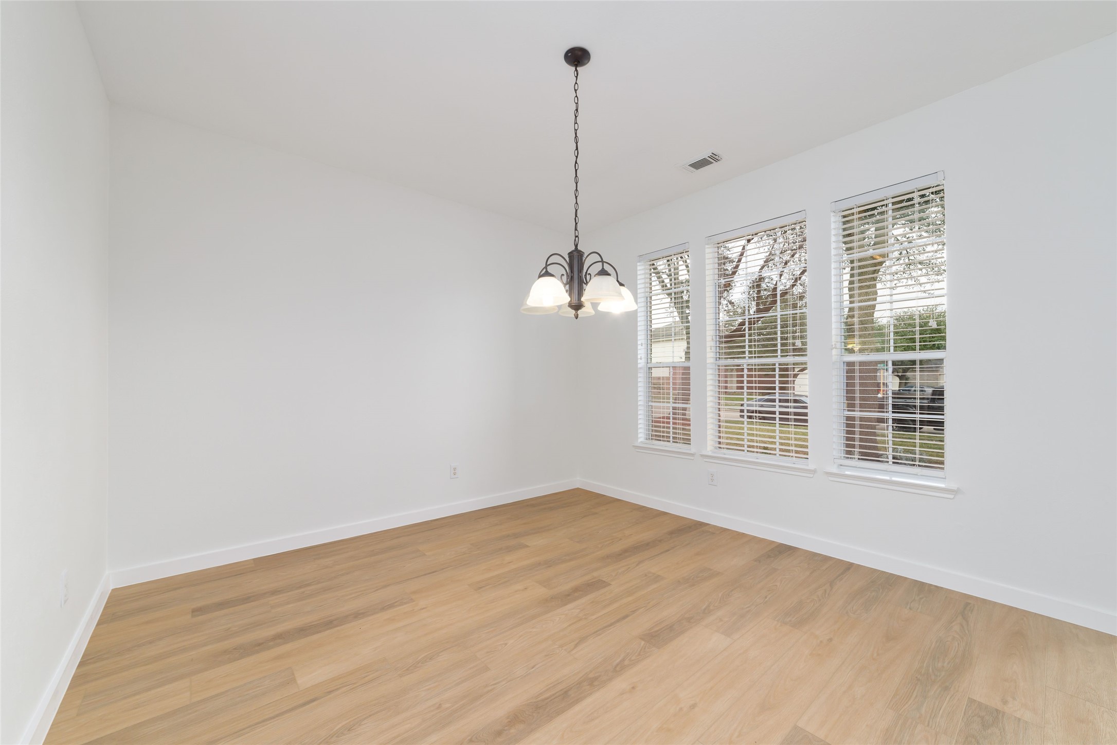 20215 Enchanted Rose Cypress, TX 77433 - Photo 4 of 24 a view of empty room with wooden floor and fan