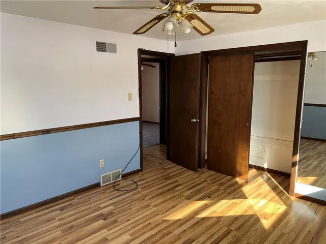 a bed room with a bed and a chandelier