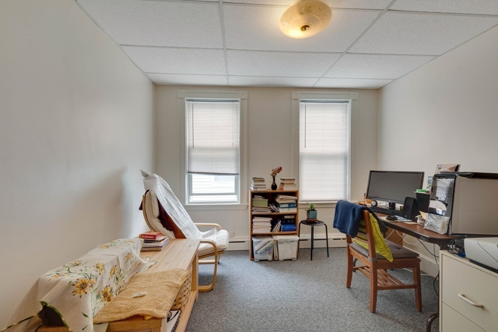 45 Jackson Road Somerville, MA 02145 - Photo 26 of 27 a view of a workspace with furniture and a window