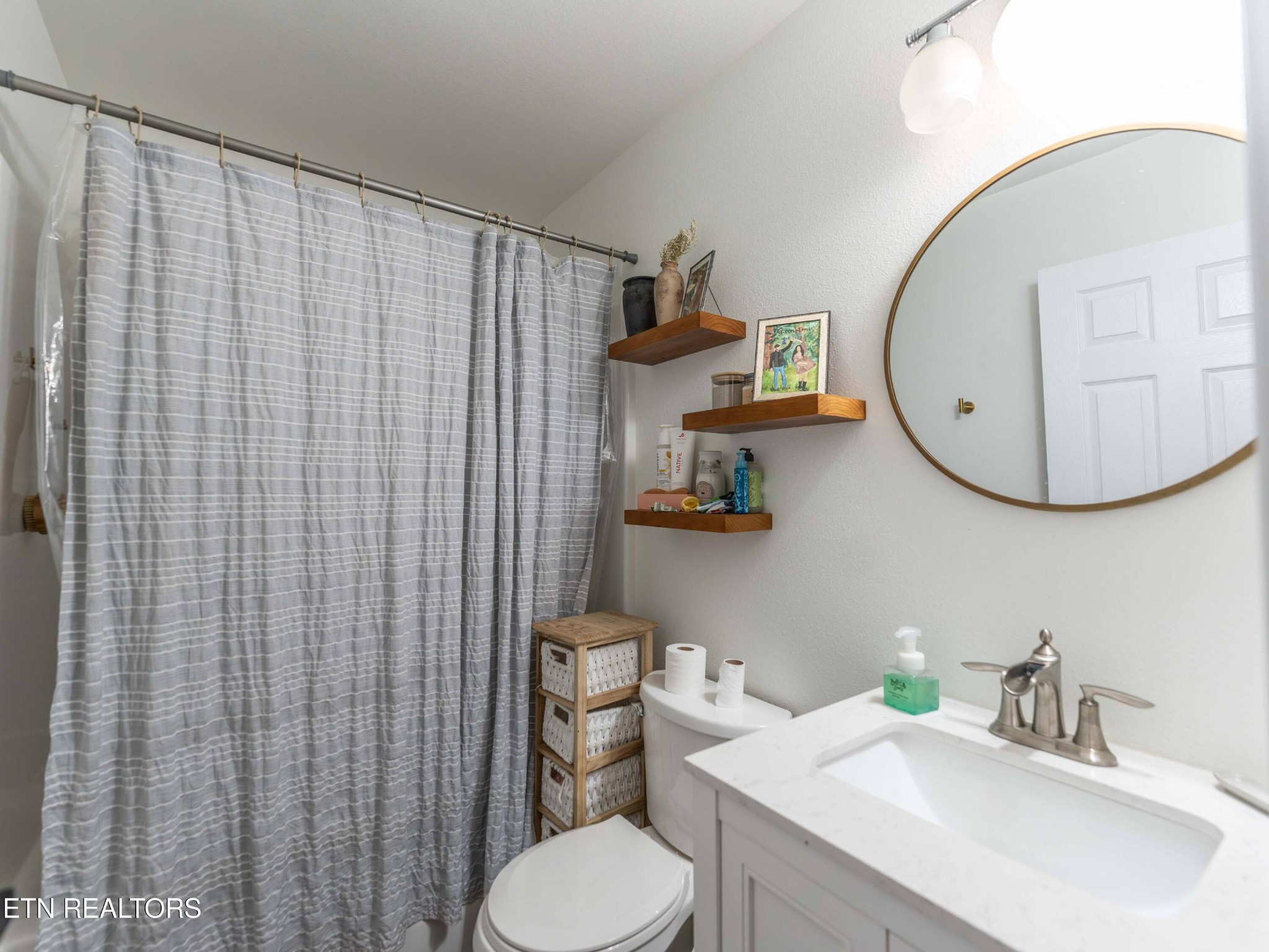 119 Bill Cobb Road Jamestown, TN 38556 - Photo 32 of 35 a bathroom with a sink a toilet and a mirror