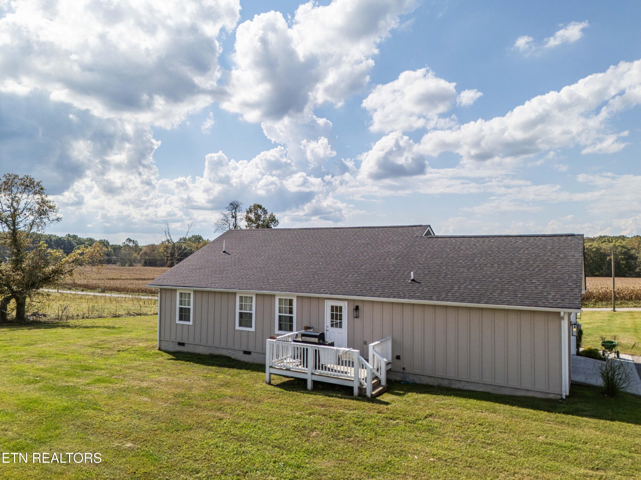 119 Bill Cobb Road Jamestown, TN 38556 - Photo 5 of 35 a view of a house with a swimming pool with a yard