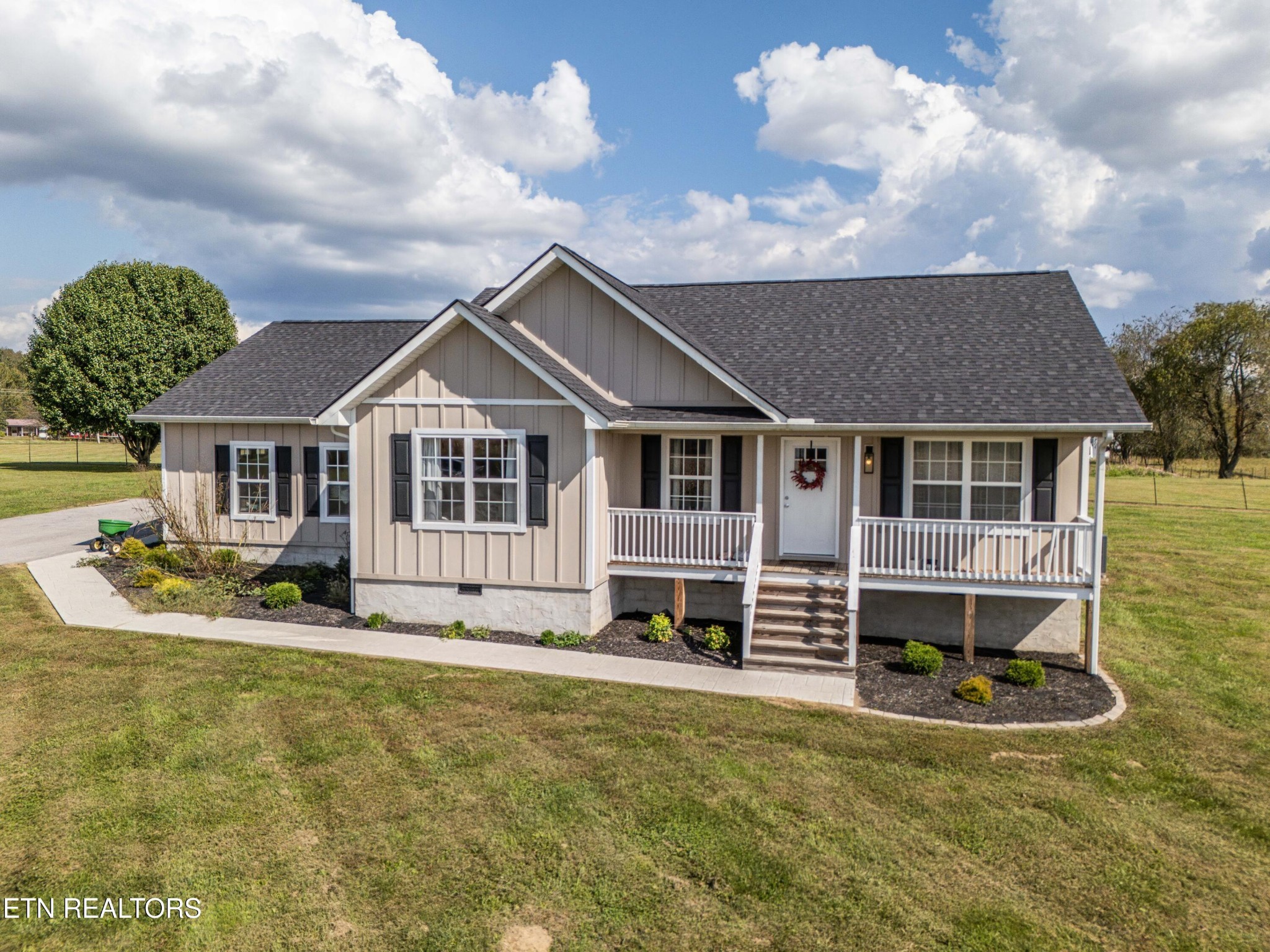 119 Bill Cobb Road Jamestown, TN 38556 - Photo 8 of 35 a front view of a house with a yard
