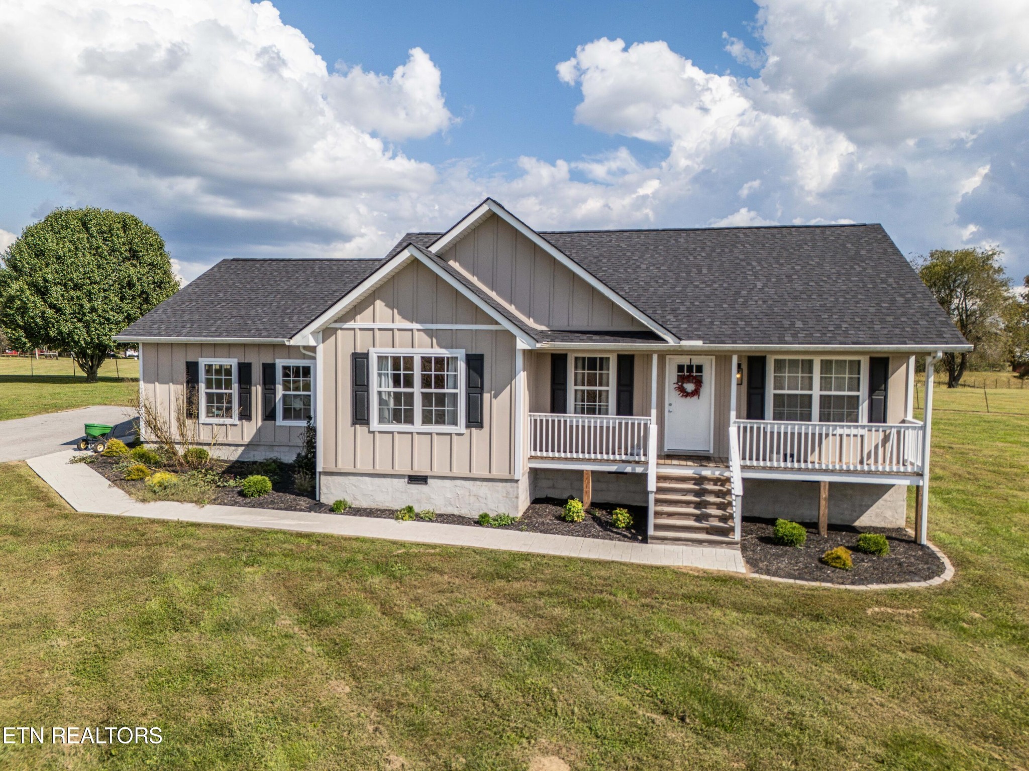 119 Bill Cobb Road Jamestown, TN 38556 - Photo 9 of 35 a front view of a house with a yard