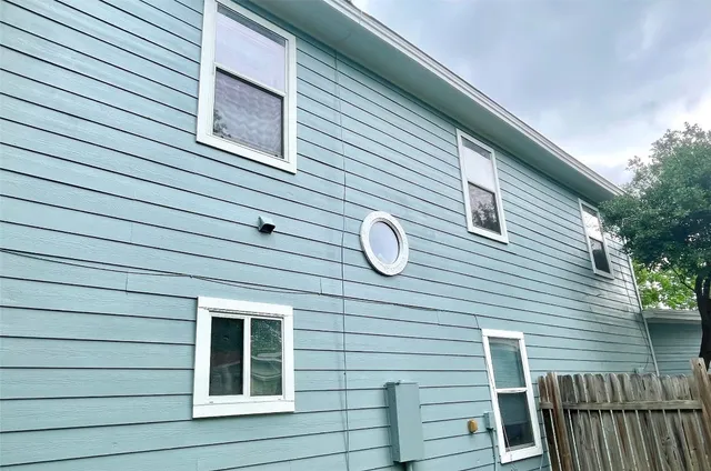 a view of a house with a large window