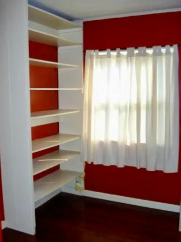 a room with a bed and a window