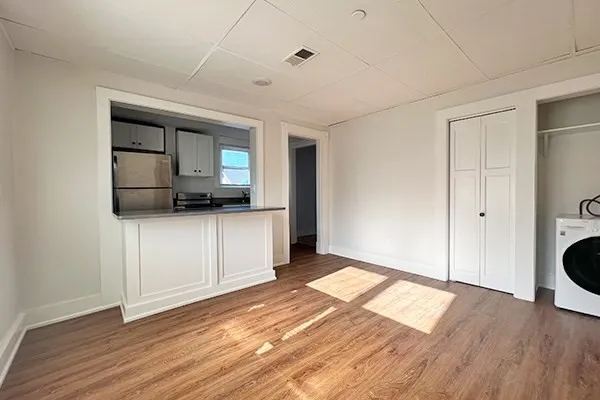 a view of a kitchen cabinets and wooden floor