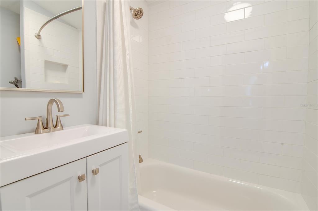 407 Northeast 8th Street Gainesville, FL 32601 - Photo 19 of 32 a bathroom with a sink and a bathtub