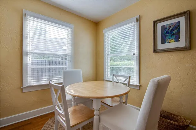 a view of a dining room with furniture window and outside view