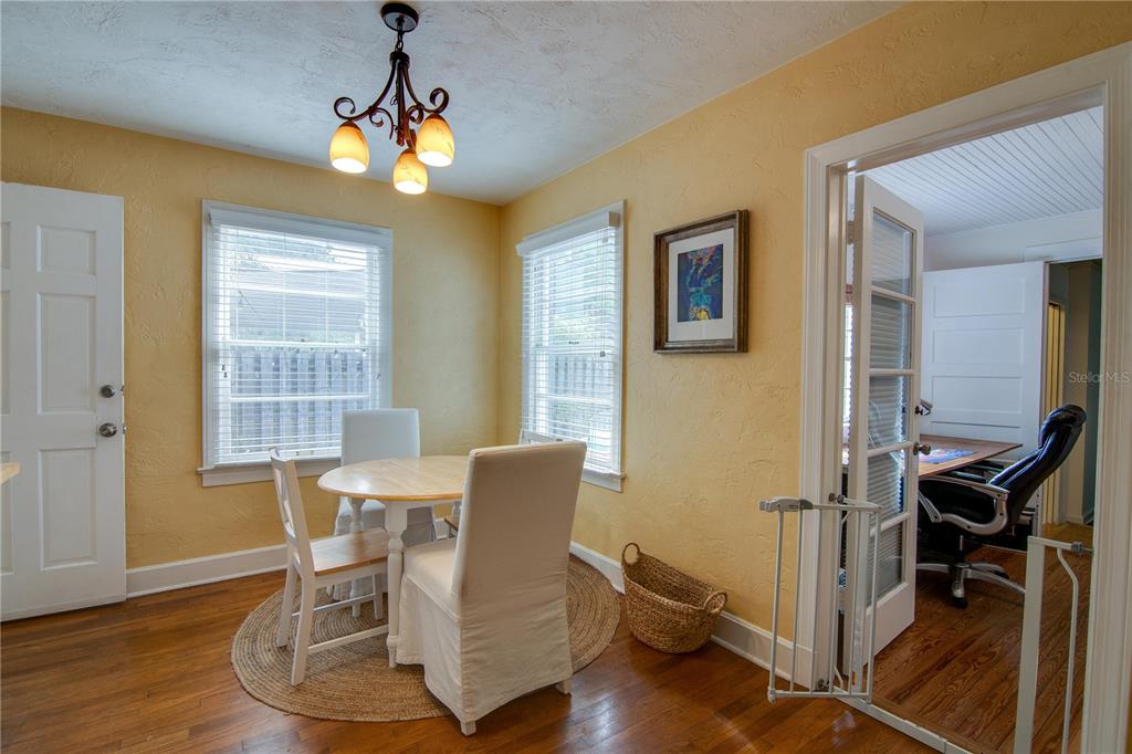 407 Northeast 8th Street Gainesville, FL 32601 - Photo 25 of 32 a view of a dining room with furniture window and wooden floor
