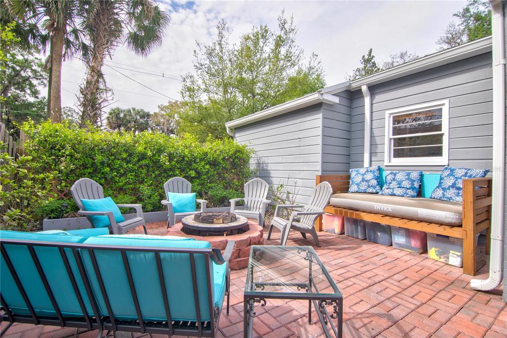 407 Northeast 8th Street Gainesville, FL 32601 - Photo 29 of 32 a view of a patio with a table and chairs