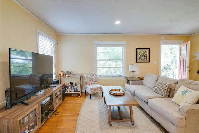 a living room with furniture and a flat screen tv