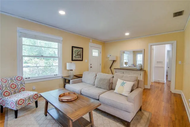 a living room with furniture and a window
