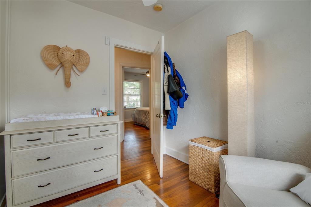 407 Northeast 8th Street Gainesville, FL 32601 - Photo 10 of 32 a living room with furniture and a mirror