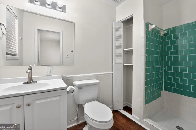 a bathroom with a sink toilet and shower
