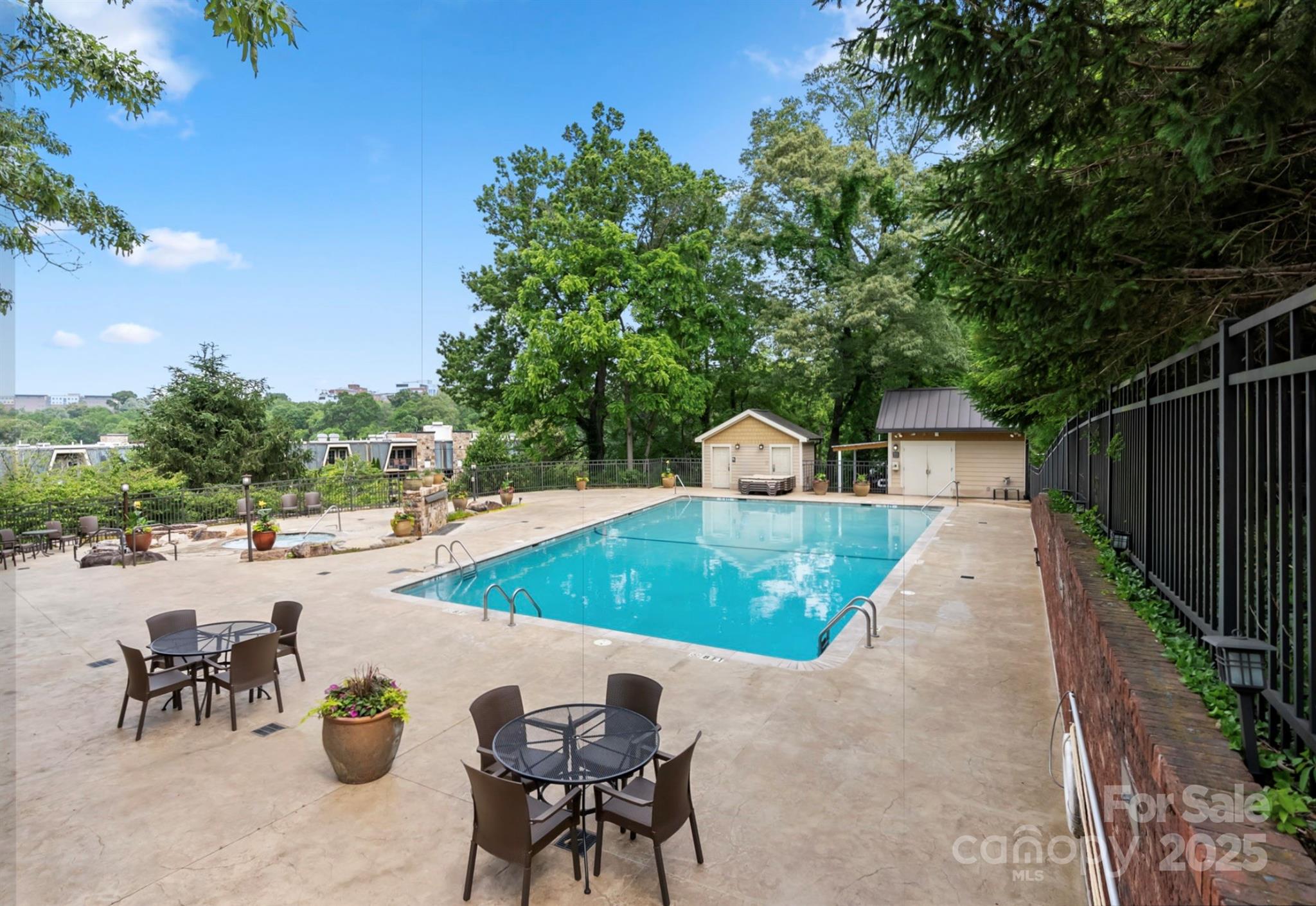 a view of a backyard patio and swimming pool