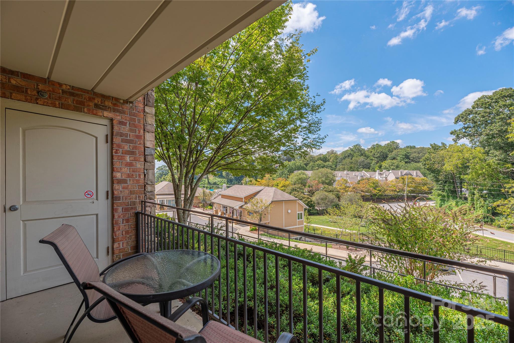 114 Bowling Park Road Asheville, NC 28803 - Photo 2 of 33 a balcony view with a sink and outdoor seating