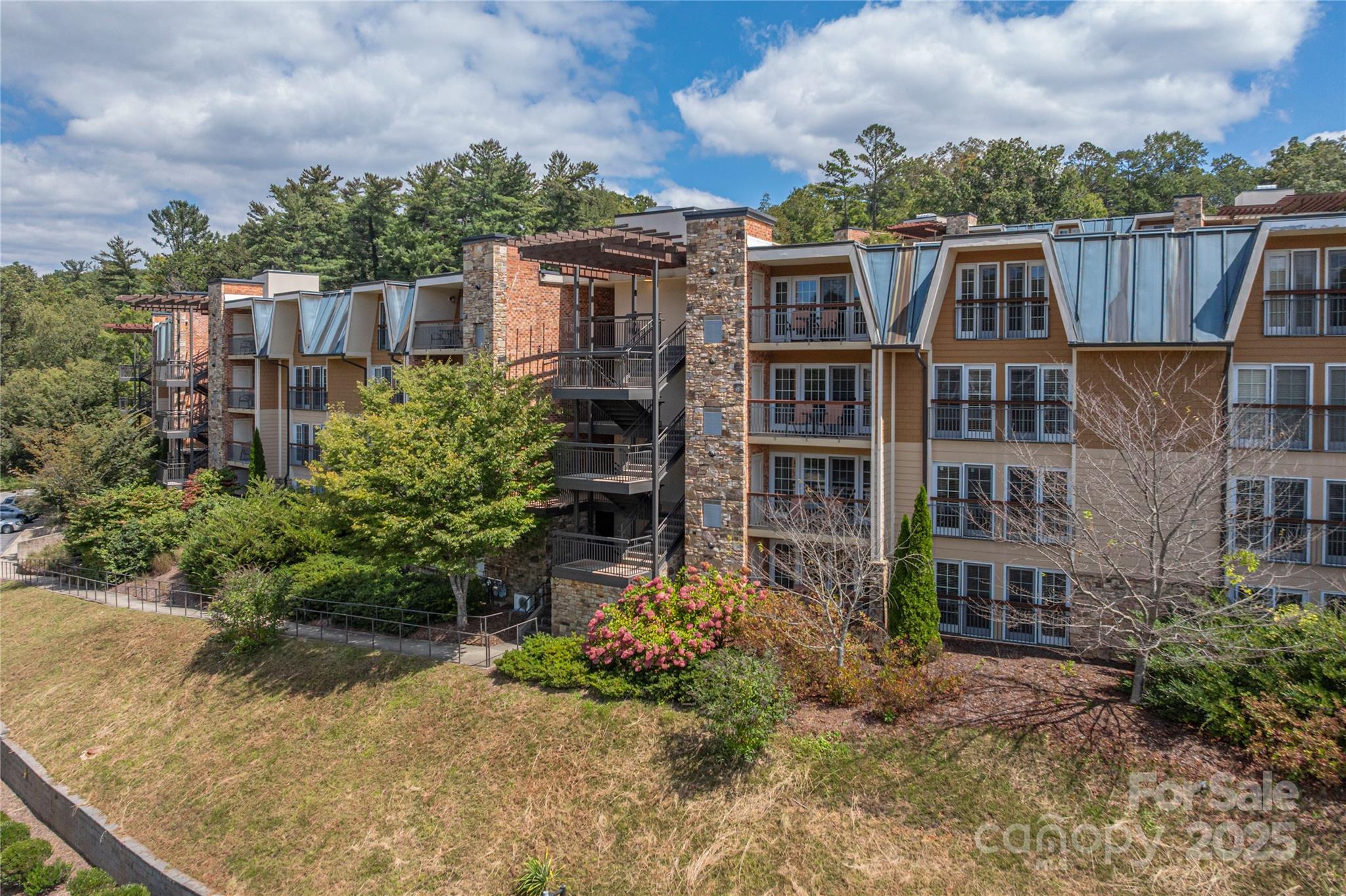 114 Bowling Park Road Asheville, NC 28803 - Photo 25 of 33 a view of a house with a yard and potted plants