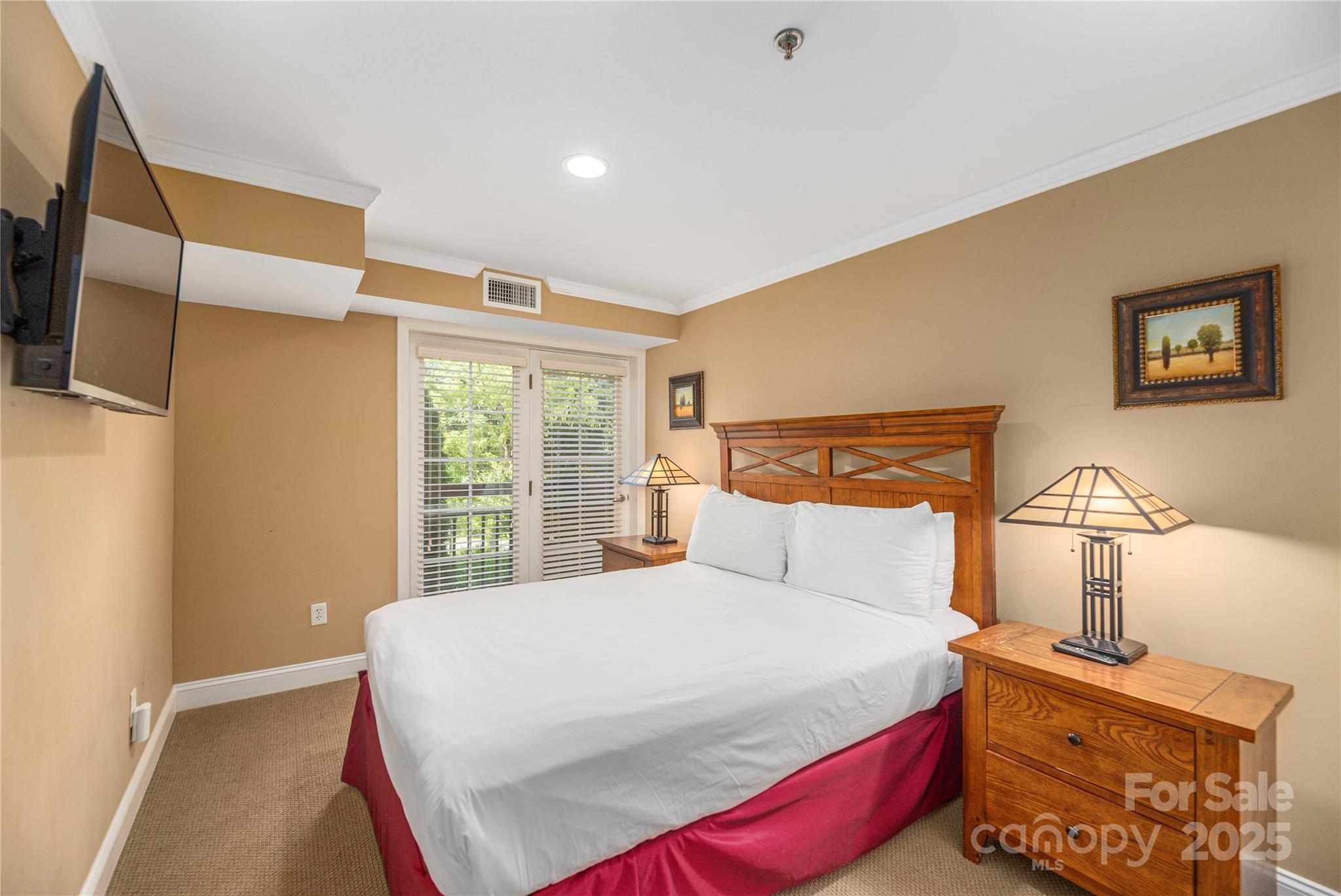 114 Bowling Park Road Asheville, NC 28803 - Photo 4 of 33 a bedroom with a bed and a window