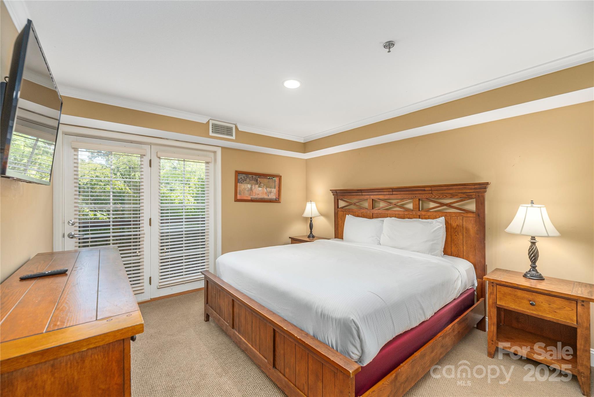 114 Bowling Park Road Asheville, NC 28803 - Photo 5 of 33 a bedroom with a bed and a night stand