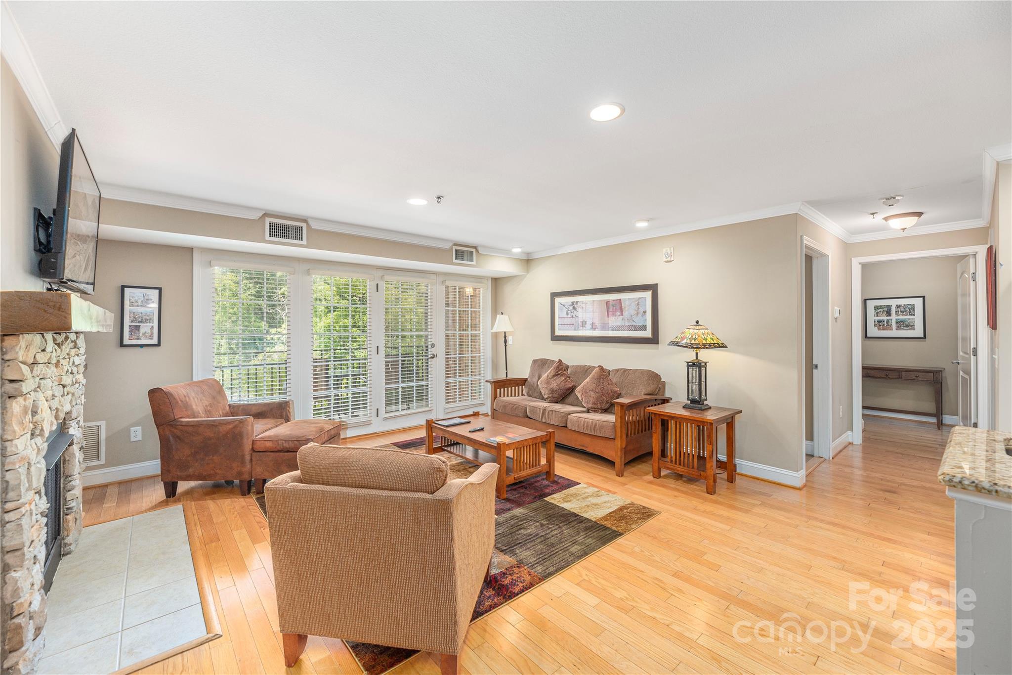 114 Bowling Park Road Asheville, NC 28803 - Photo 6 of 33 a living room with furniture and a flat screen tv