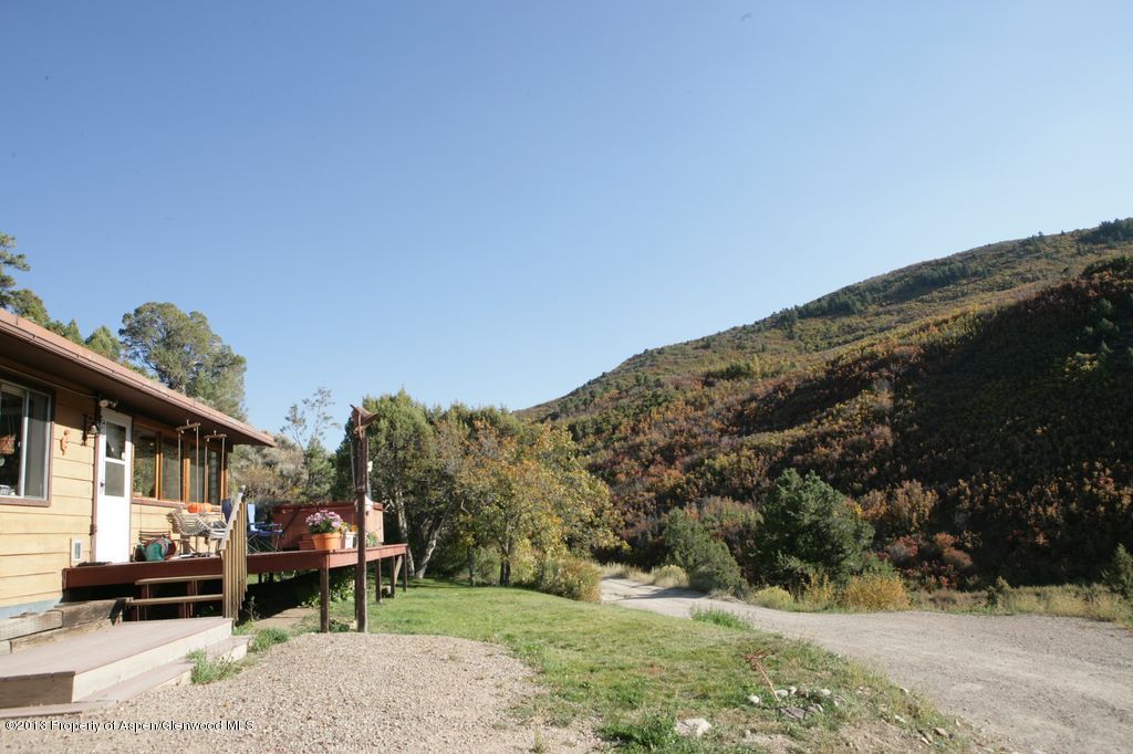 3691 East Sopris Creek Road Basalt, CO 81621 - Photo 6 of 9 a front view of a house with a yard