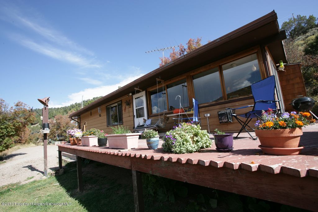 3691 East Sopris Creek Road Basalt, CO 81621 - Photo 7 of 9 a view of a house with backyard and sitting area