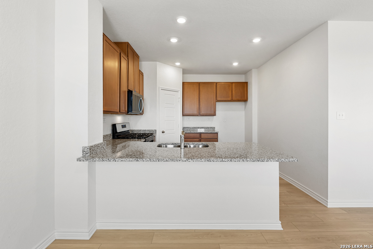 10045 Jagger Avenue Converse, TX 78109 - Photo 12 of 28 a view of a kitchen with a sink and a mirror