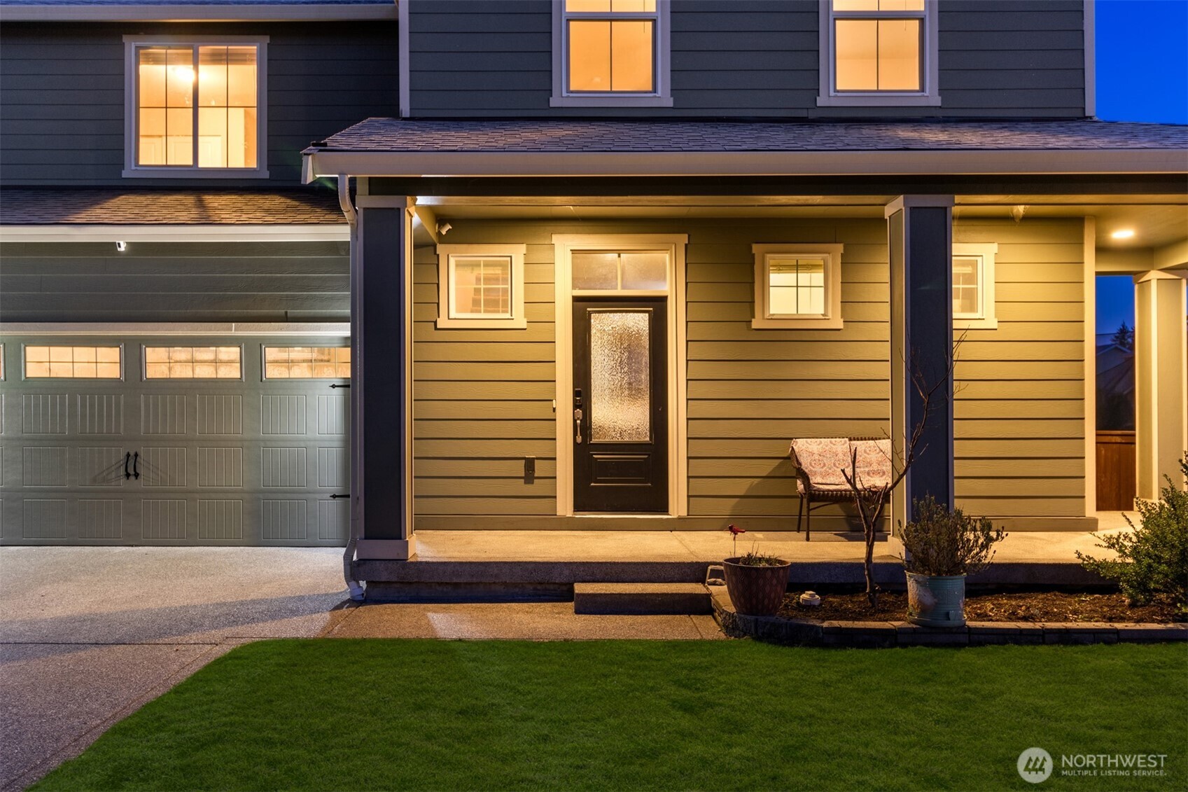 985 Riley Drive East Enumclaw, WA 98022 - Photo 2 of 33 a front view of a house with a yard