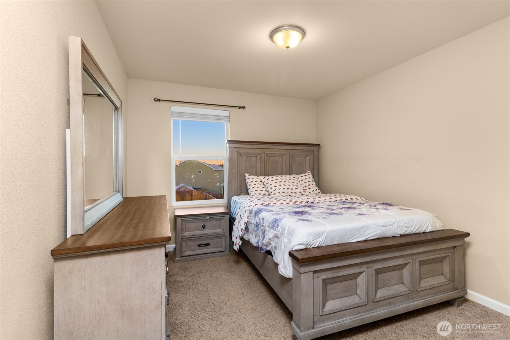 985 Riley Drive East Enumclaw, WA 98022 - Photo 23 of 33 a bedroom with a bed and a dresser
