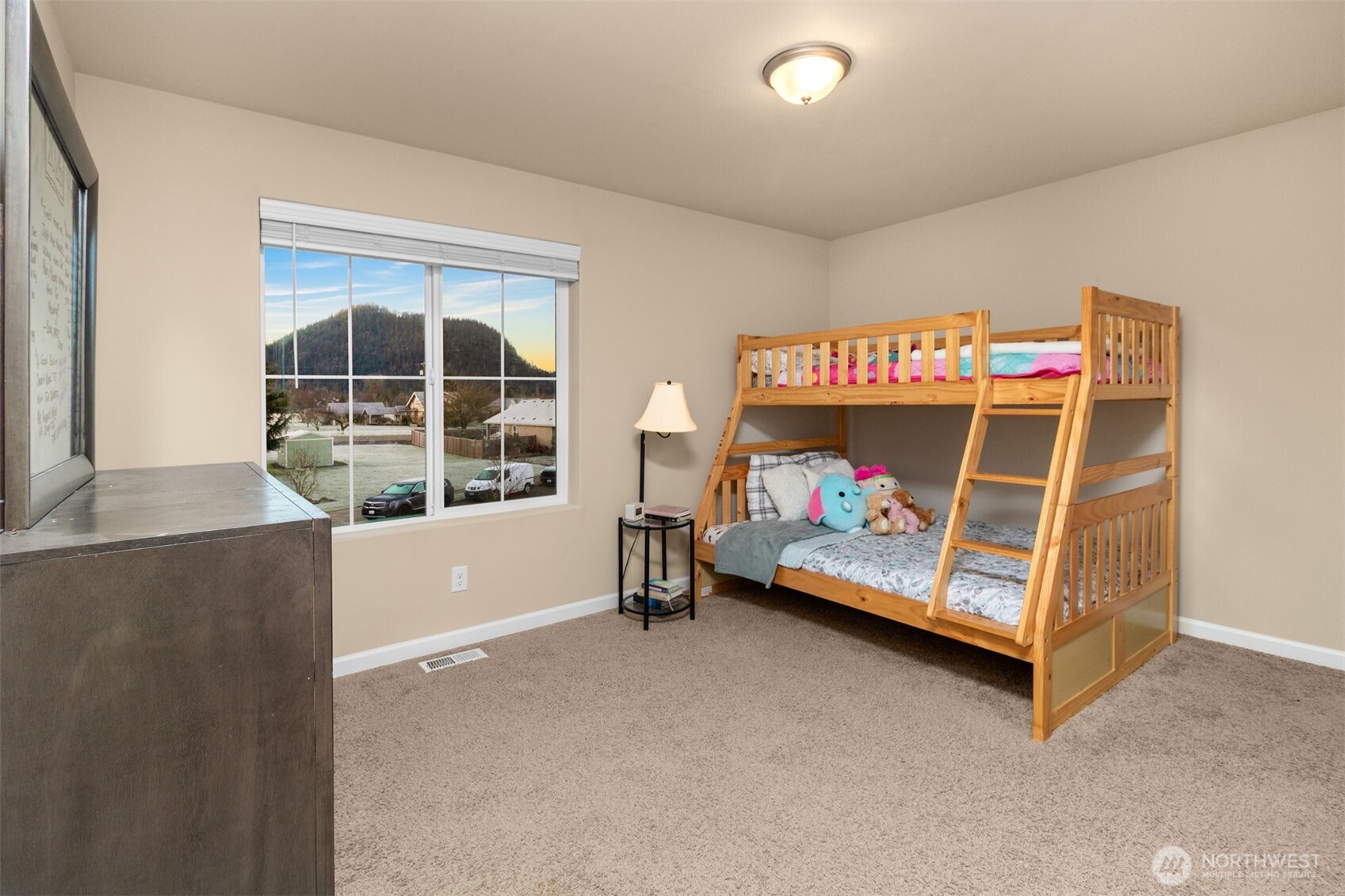 985 Riley Drive East Enumclaw, WA 98022 - Photo 24 of 33 a bedroom with bed and a window