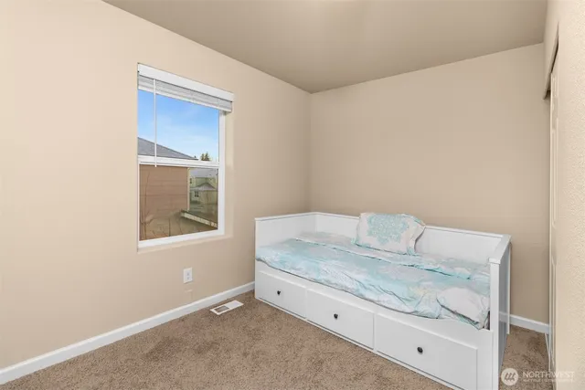 a bathroom with a sink a toilet and shower curtain
