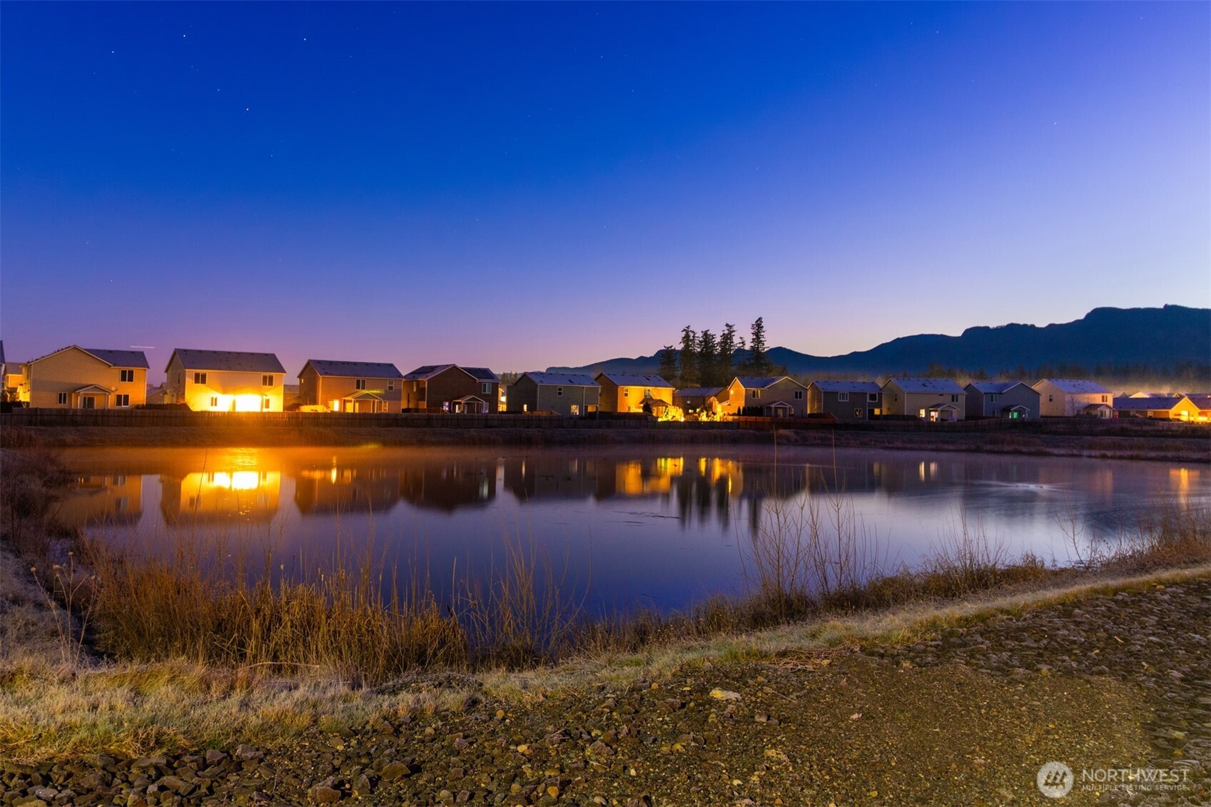 985 Riley Drive East Enumclaw, WA 98022 - Photo 33 of 33 a view of a lake with houses