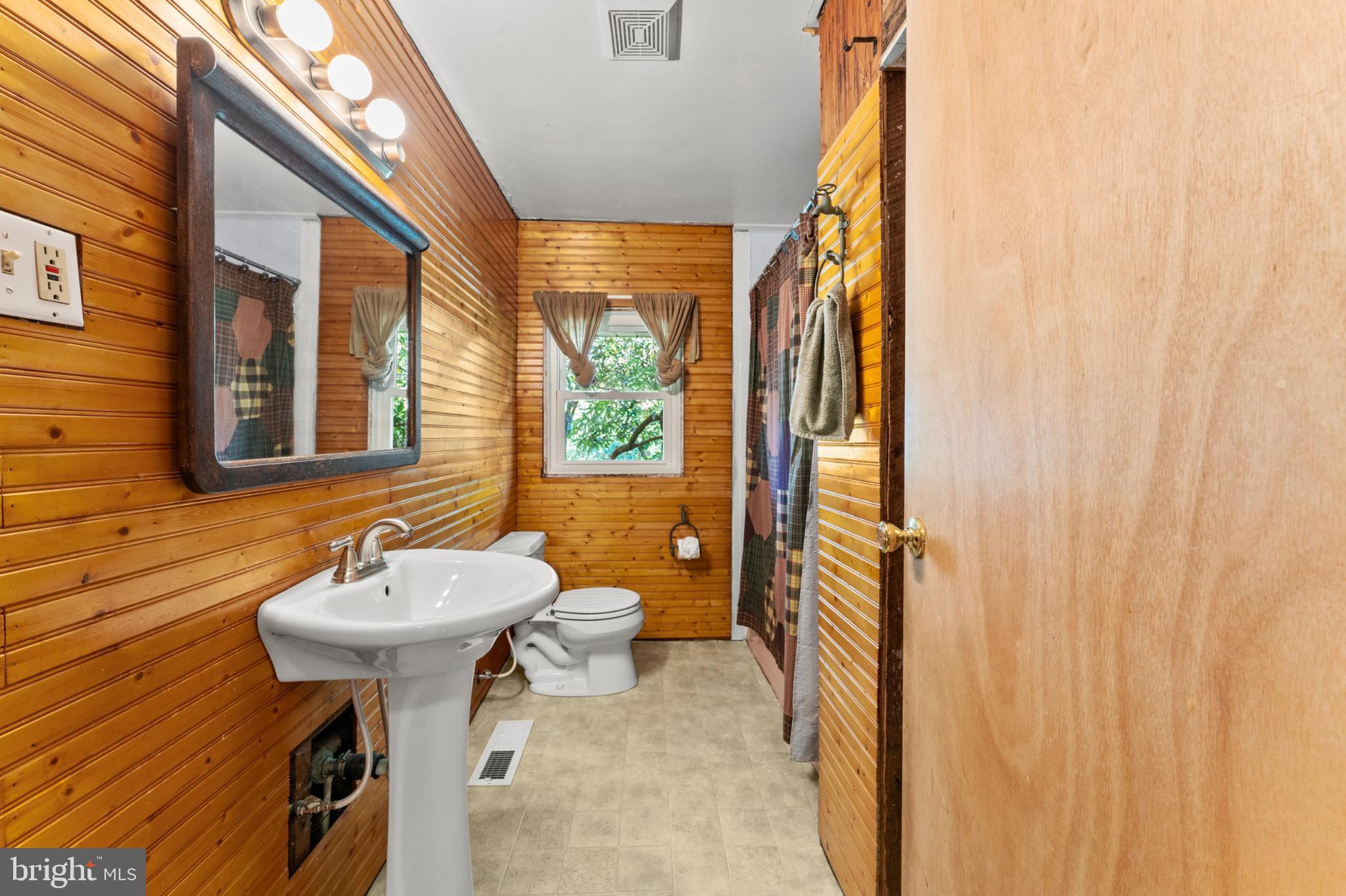 3615 Rockdale Road Manchester, MD 21102 - Photo 23 of 52 Charming rustic bathroom with wooden accents.
