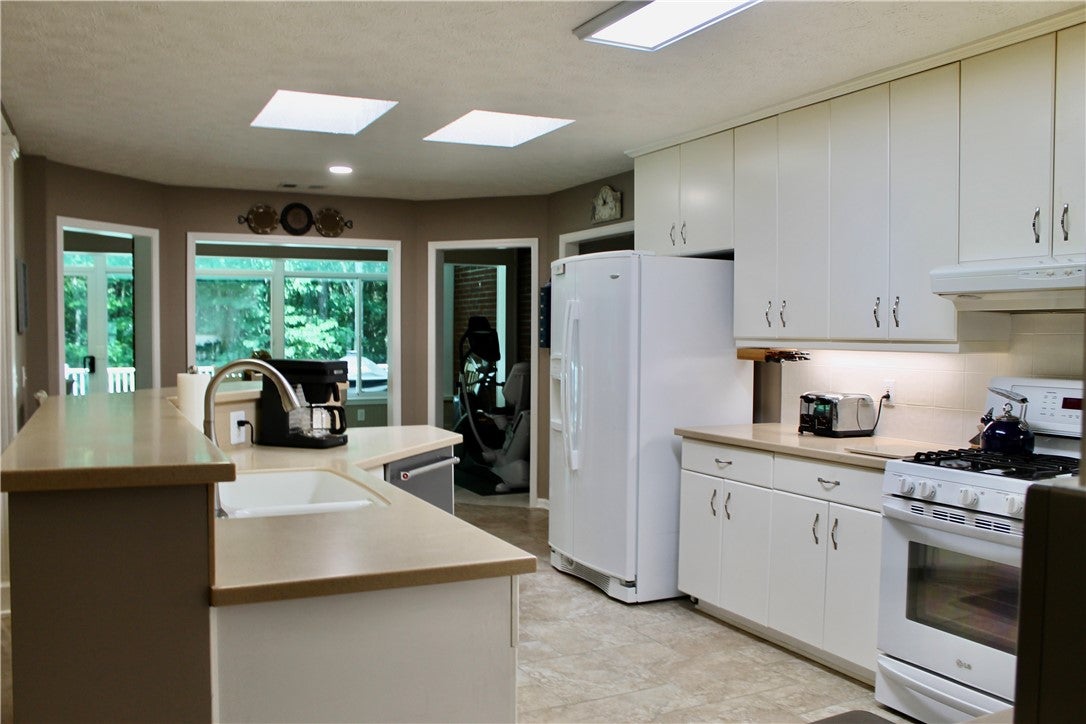 575 Deer Run Road Auburn, AL 36832 - Photo 17 of 42 Note the dual skylights in the kitchen. The natural light is wonderful.