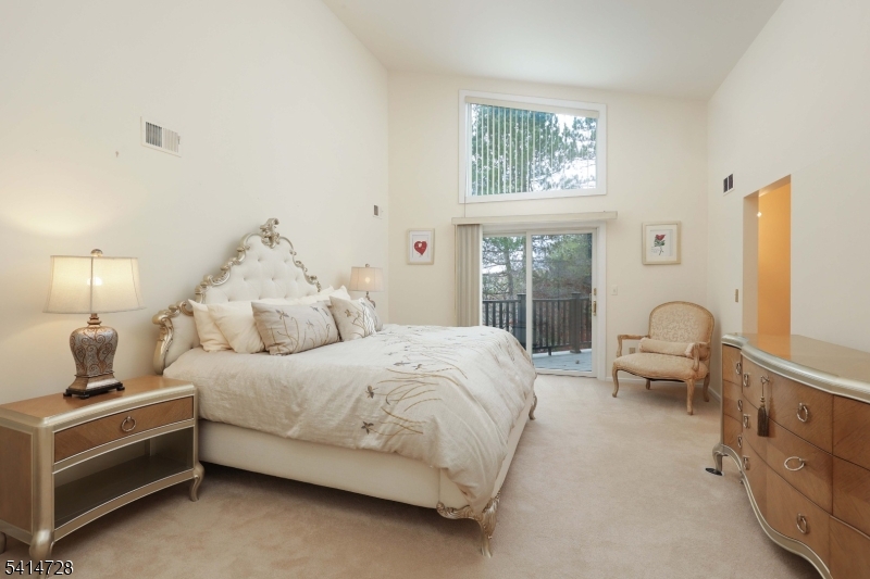 8 Union Hill Road Denville, NJ 07834 - Photo 18 of 47 a bedroom with a bed and a large window