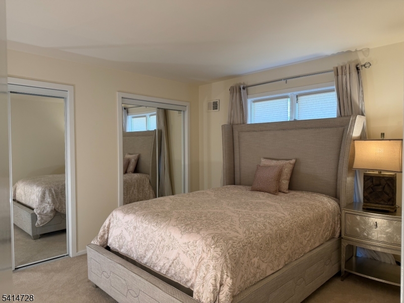 8 Union Hill Road Denville, NJ 07834 - Photo 22 of 47 a bedroom with a bed and a walk in closet