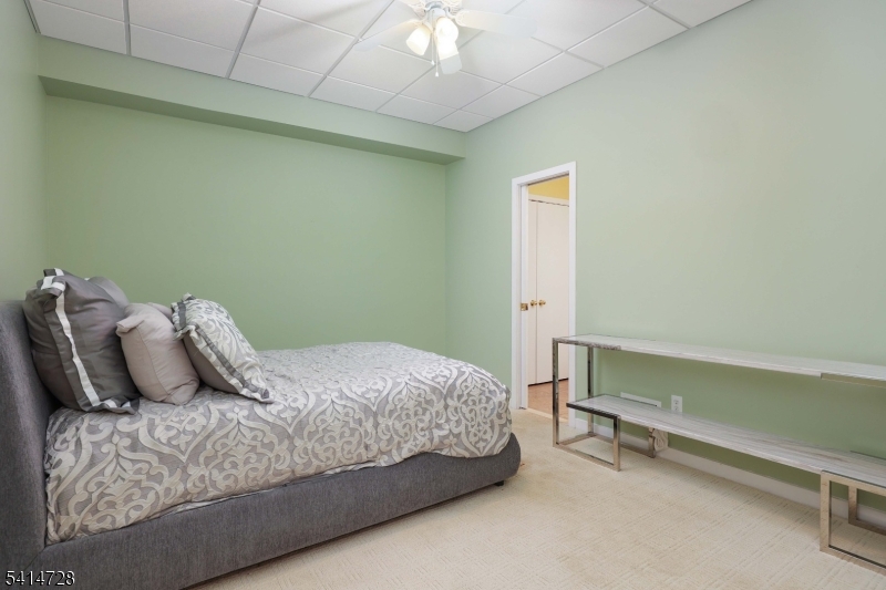 8 Union Hill Road Denville, NJ 07834 - Photo 28 of 47 a bedroom with a bed and a dresser