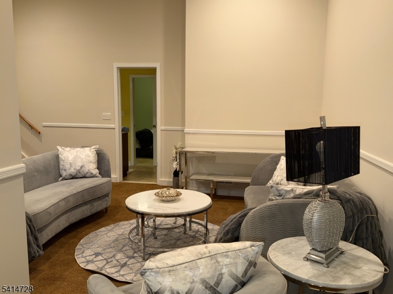 8 Union Hill Road Denville, NJ 07834 - Photo 32 of 47 a living room with furniture and a lamp