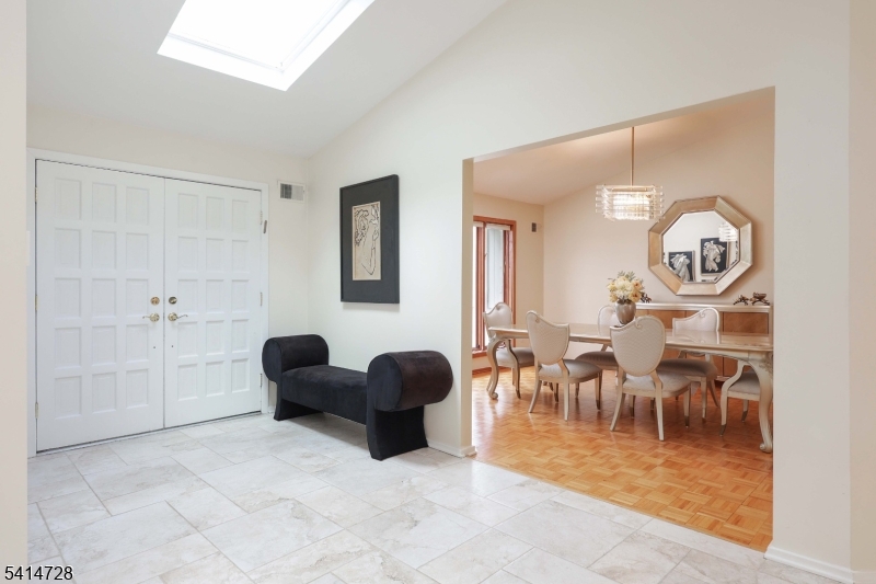 8 Union Hill Road Denville, NJ 07834 - Photo 7 of 47 a living room with furniture a clock on wall and a window