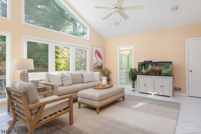 8 Union Hill Road Denville, NJ 07834 - Photo 10 of 47 a living room with furniture a flat screen tv and a window