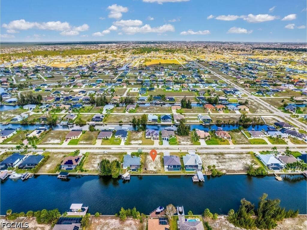 1702 Old Burnt Store Road North Cape Coral, FL 33993 - Photo 10 of 14 an aerial view of residential houses with outdoor space and swimming pool