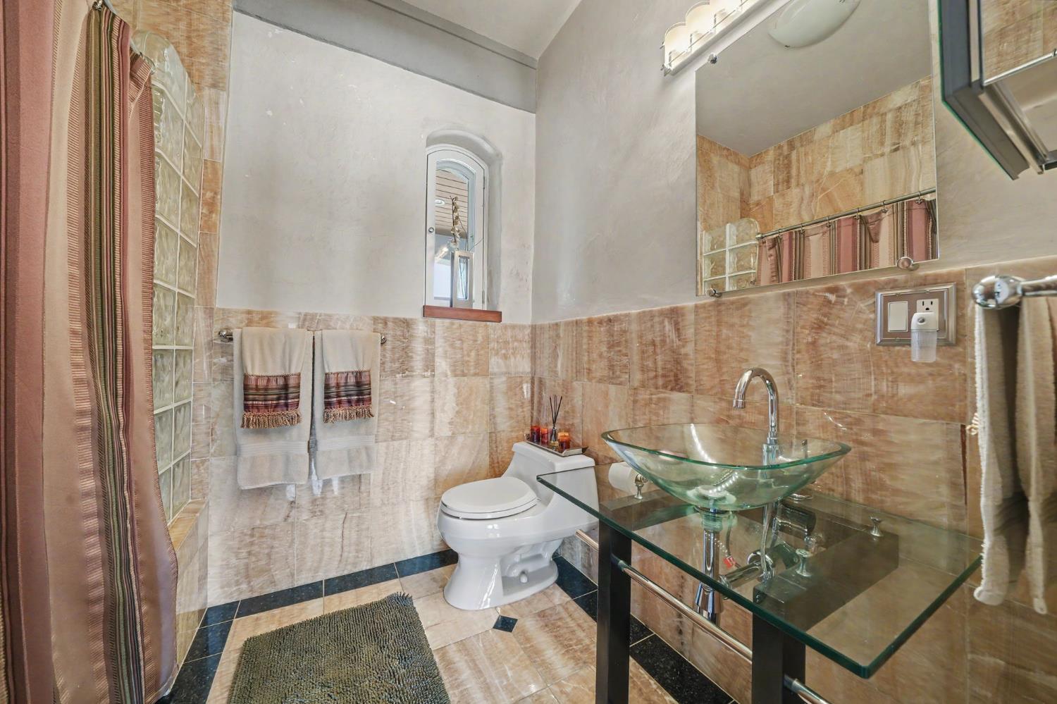 15070 Willow Creek Road Ione, CA 95640 - Photo 56 of 66 a bathroom with a toilet and a shower