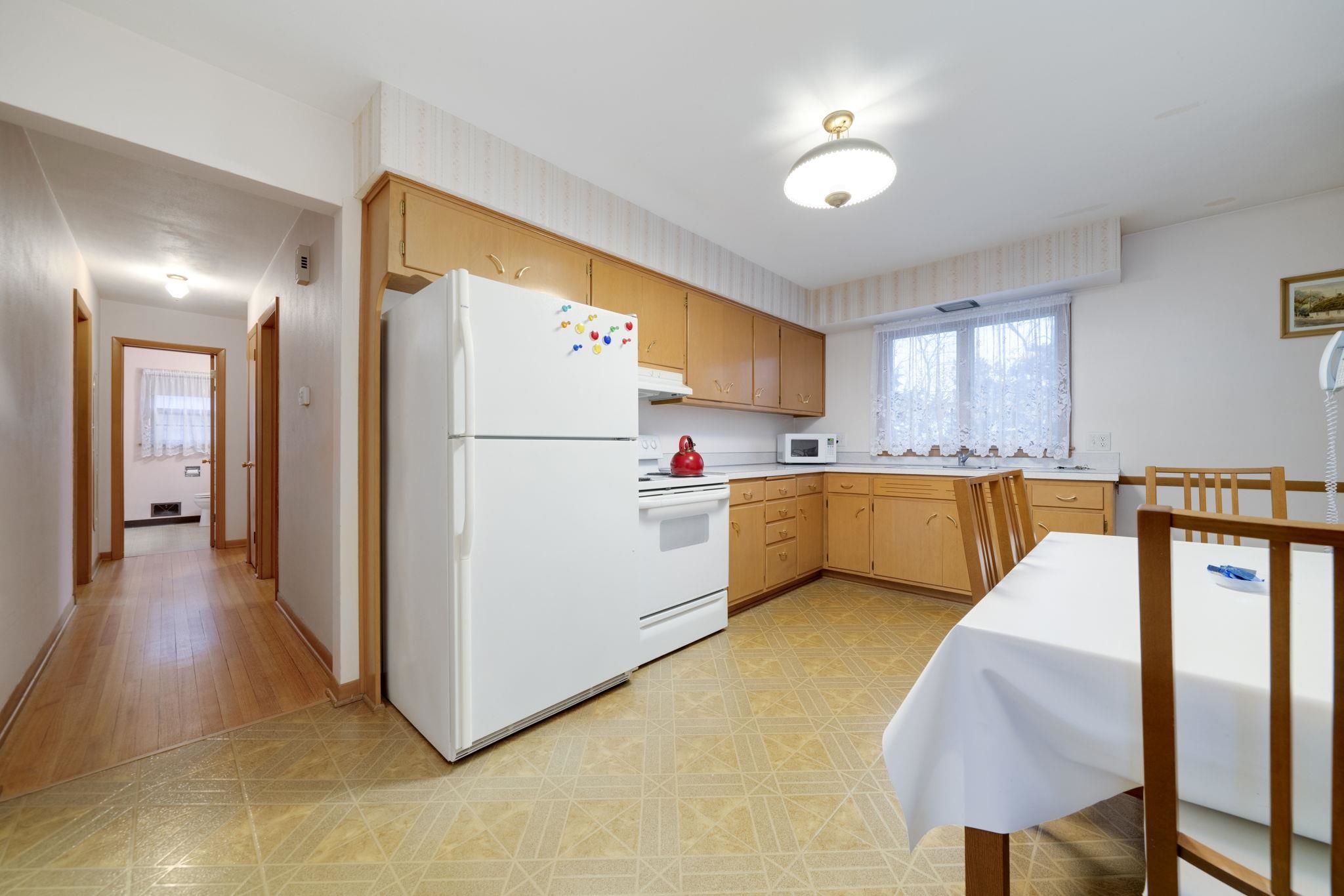3816 Shirley Road Rockford, IL 61108 - Photo 19 of 31 a kitchen with stainless steel appliances a refrigerator sink and cabinets