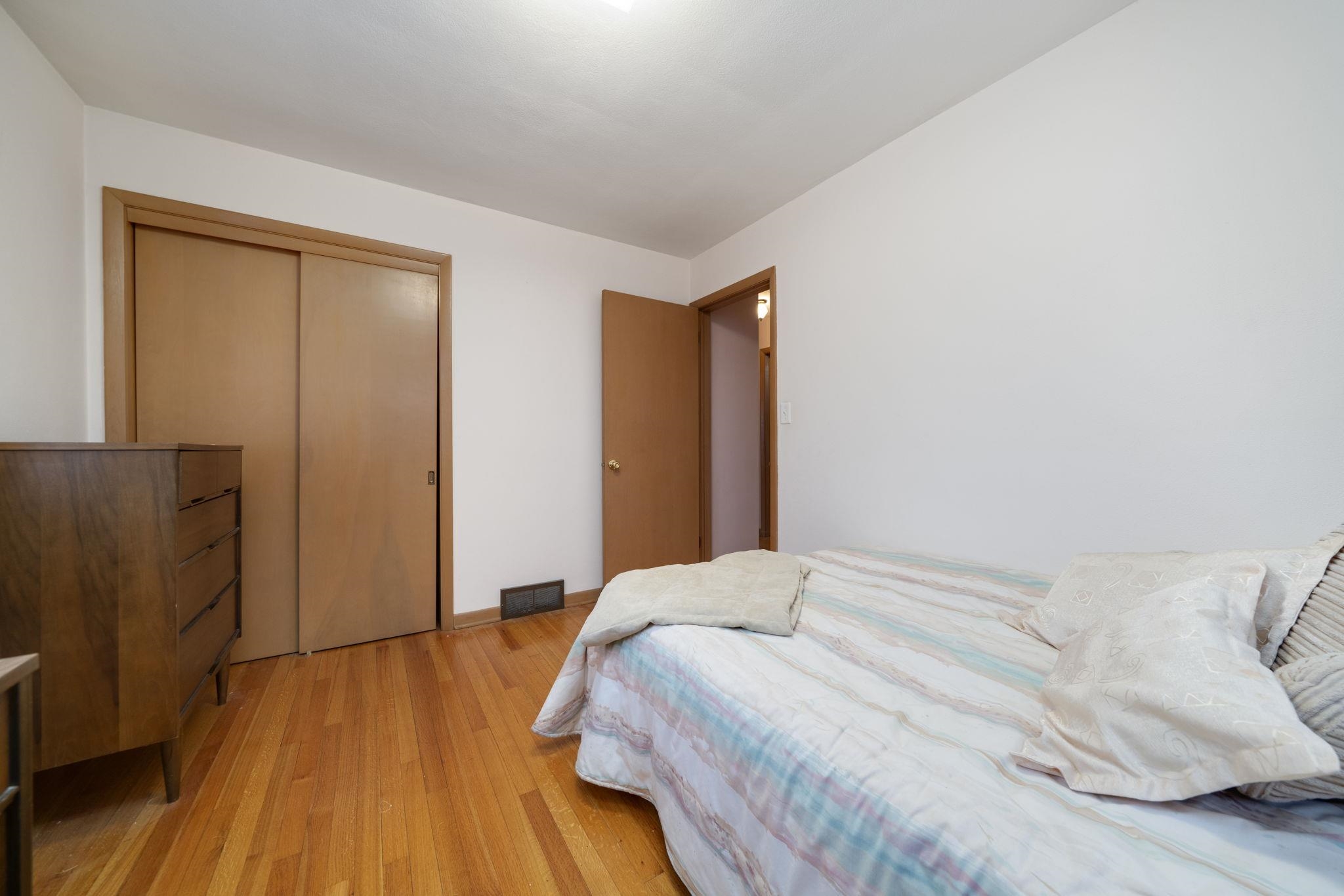 3816 Shirley Road Rockford, IL 61108 - Photo 5 of 31 a bedroom with a bed and wooden floor