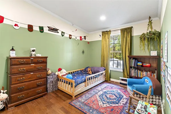 a living room with furniture and a dresser