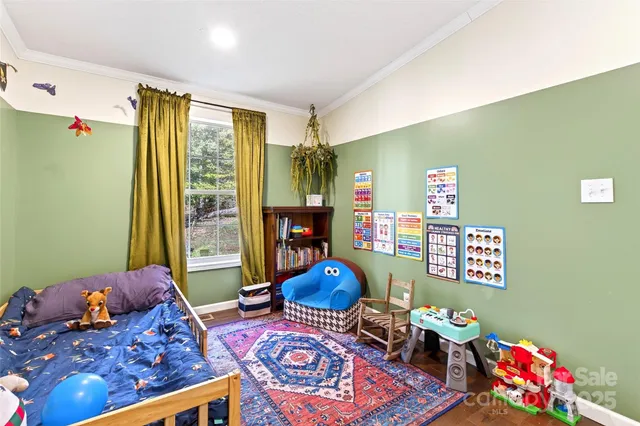 a bedroom with furniture and a window